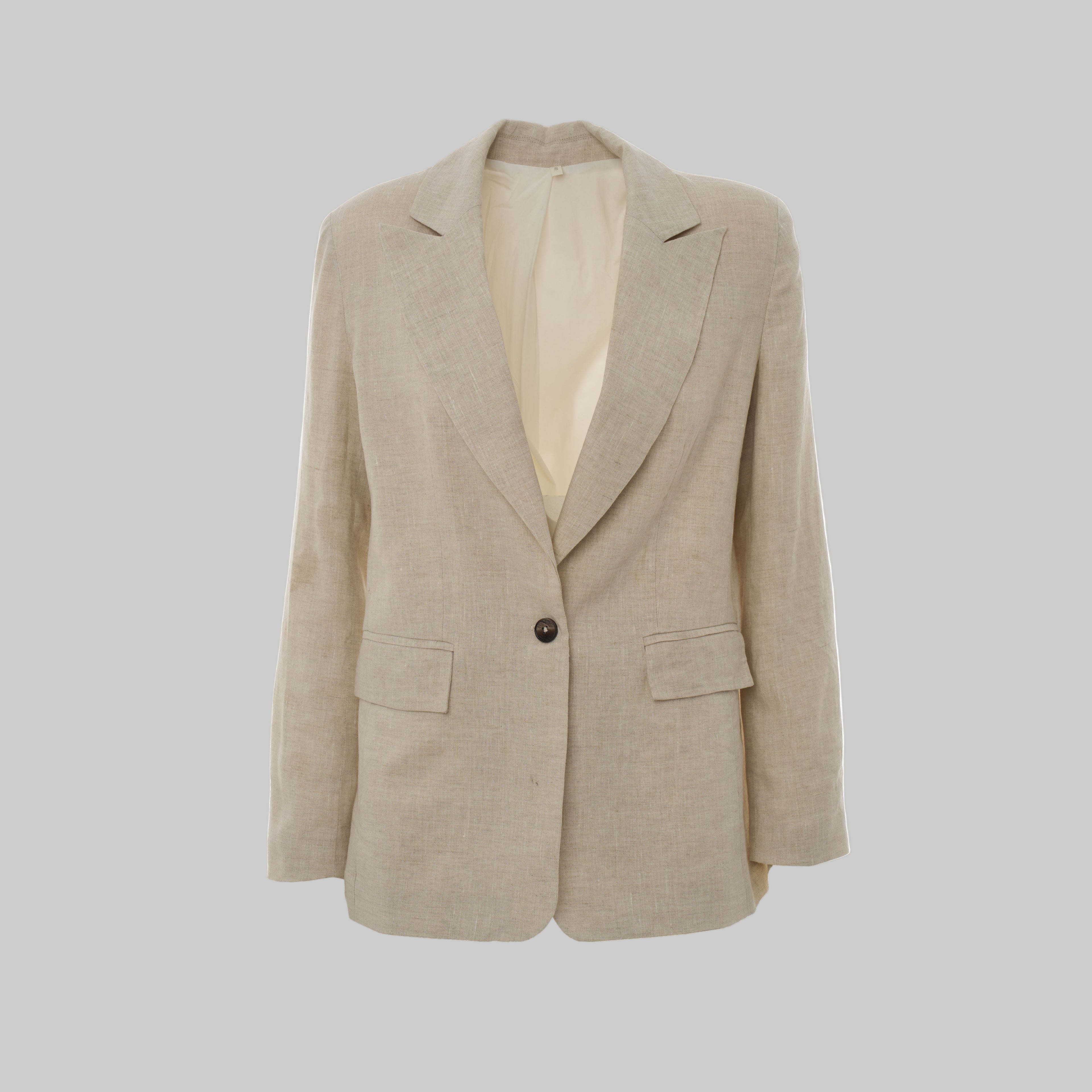 Beige blazer on a light gray background