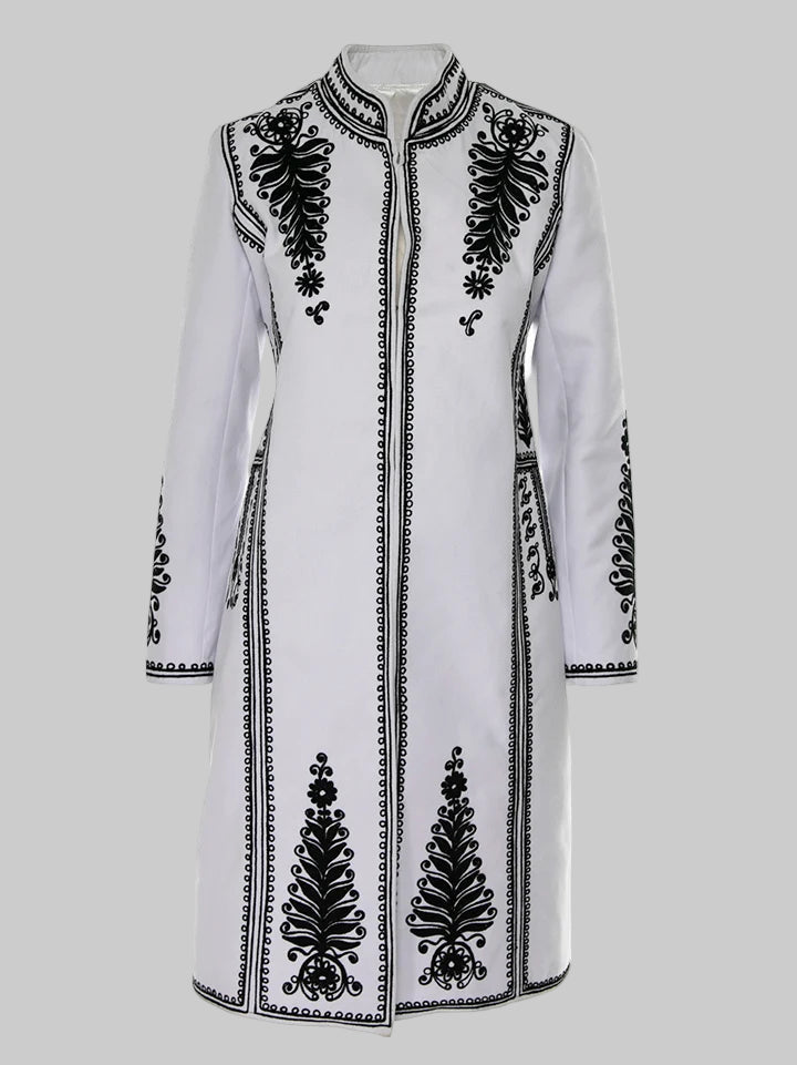 White coat with black embroidery on a white background