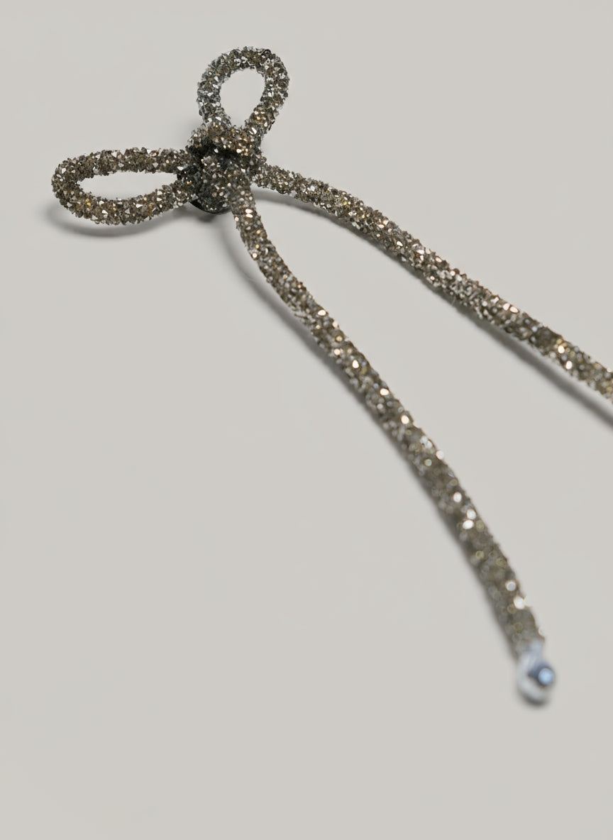 Metallic hair tie on a white background