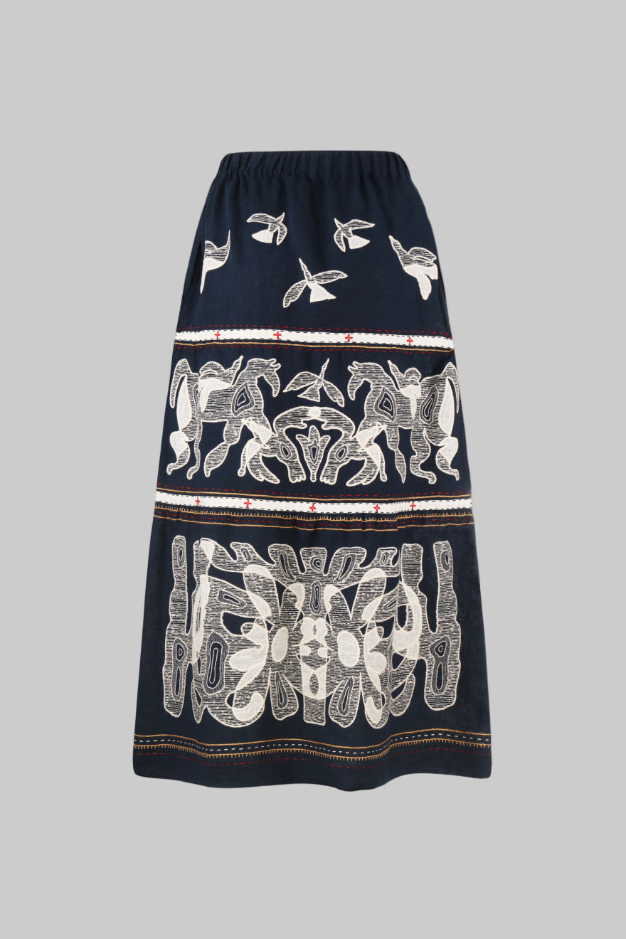 Navy blue skirt with white floral patterns on a white background