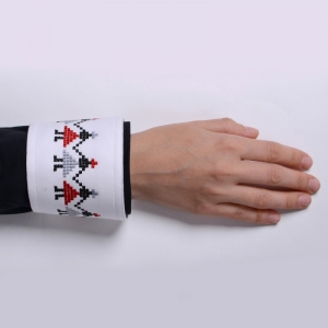 Shirt cuff with embroidered motifs